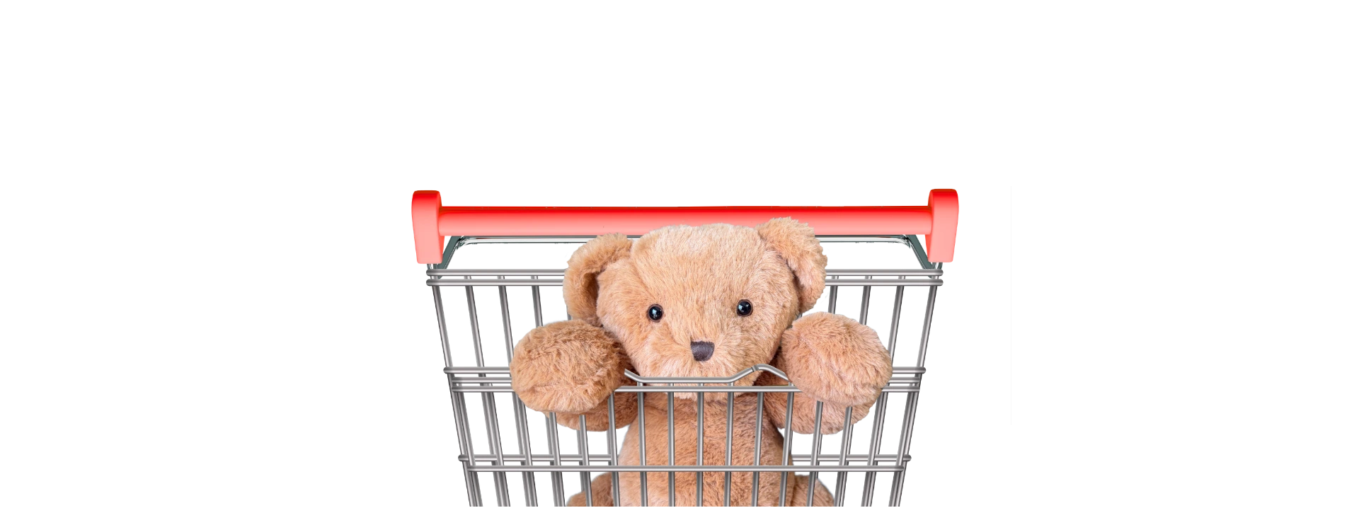 A small brown teddy bear sitting inside a metal shopping cart with a red handle, isolated on a white background.